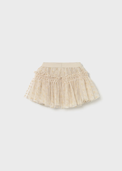 Beige tulle skirt on a white background